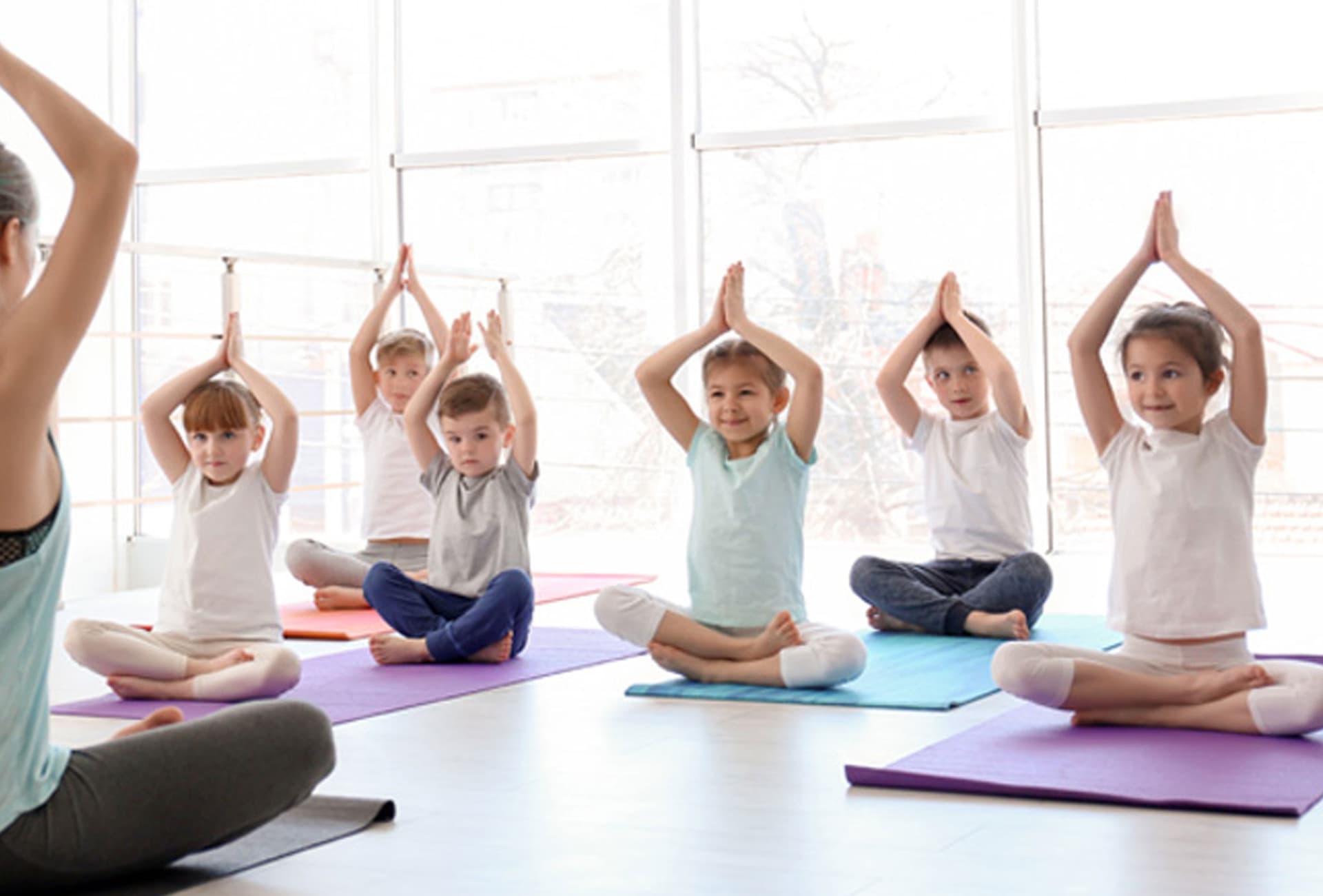 Children developing focus, flexibility, and confidence in a playful kids yoga class